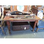 A late Victorian mahogany extending dining table, with  moulded top on turned fluted tapering legs,