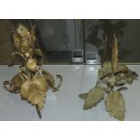 Two early 20th century gilt metal candlesticks, of leaf and floral form.