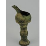 A Han Dynasty style cast metal oil lamp, H. 20.5cm.