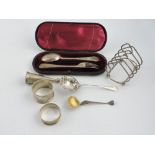 A cased VIctorian silver spoon and fork set, a George V silver toast rack,