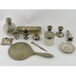 A late Victorian silver-mounted glass scnt bottle, a silver mounted hand mirror, brush ,