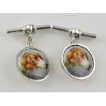 A pair of white metal cufflinks, the discs with hunting dog's heads, on chain and bar, 10g.