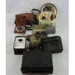 Assorted military badges, to include a German belt buckle, a dry card compass,