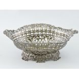 A Victorian silver bonbon basket, London 1894, of pierced oval form with floral cast border, L.