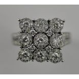An 18ct white gold large cluster diamond ring in the form of a square, total 1.4ct.