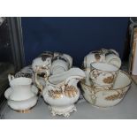 A mid-19th century gilt part tea service, comprising ten cups, six saucers, two serving plates,