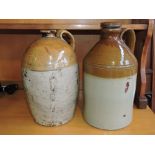 A Victorian stoneware flagon together with a similar later flagon.