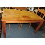 A rectangular pine kitchen table.