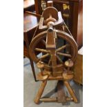 A large 20th Century Welsh style oak spinning wheel