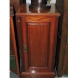 A late Victorian panelled mahogany bedside cabinet.