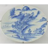 A late 19th century Chinese blue and white charger, decorated with an extensive landscape scene, D.