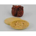 A carved hardwood netsuke of two entwinned mice, W. 4.