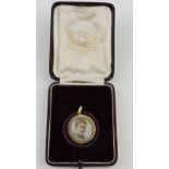 A late Victorian 15ct and seed pearl double portrait locket.