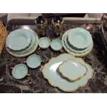 A Maryse Boxer for Samuel Heath part dinner service, aqua with gilt rims,