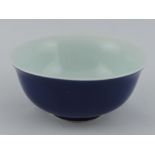 A royal blue glazed rice bowl, with white interior, D. 13cm.