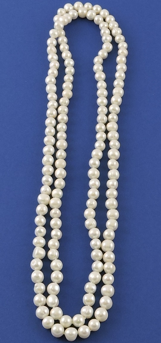 An opera length string of freshwater pearls, L.138cm.