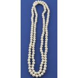 An opera length string of freshwater pearls, L.138cm.