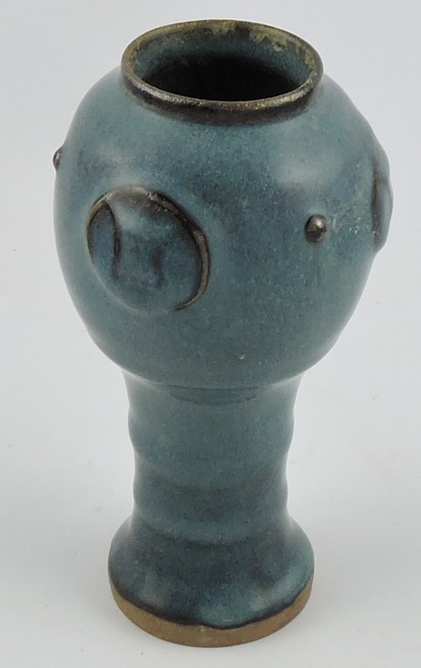 A jun ware waisted vase, with red streaked blue glaze and three roundles, H. 18cm.