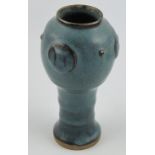 A jun ware waisted vase, with red streaked blue glaze and three roundles, H. 18cm.