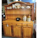 A reproduction pale walnut dining suite comprising 3 drawer dresser,