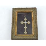 A late 19th Century Italian gilt metal micromosaic cross contained in a glazed giltwood and gesso