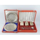 A pair of cased Indian silver engraved card trays together with a cased Indian silver beaker and