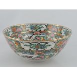 A Chinese famille rose bowl, decorated all over with vignettes of birds amongst flowers,