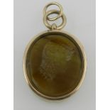 A yellow metal mounted glass intaglio portrait pendant of a Classical lady,