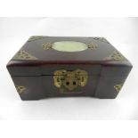 A Chinese jade inlaid and brass mounted jewellery box, having silk lined interior. H.10cm L.20cm D.