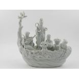 A Chinese blanc de chine porcelain figural study of Geishas in a stylised boat. H.23cm