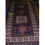 A Kazak Karachoff Afghan blue ground rug, having geometric pattern to centre,