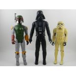 'Three various Star Wars action figures, to include a Stormtrooper, , Darth Vader, and Boba Fett. H.