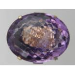 A 14 carat yellow gold, amethyst, and diamond ring, set large faceted amethyst,