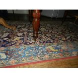 A North West Persian carpet, decorated with floral and zoomorphic motifs,