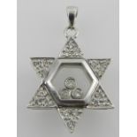 An 18 carat white gold and diamond set Star of David pendant,