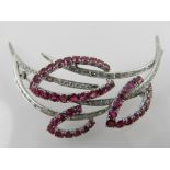 A white gold, diamond, and ruby set spray brooch,