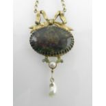 A yellow metal mounted opal pendant, set large central black opal,