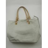 A Michael Kors beige leather tote handbag,