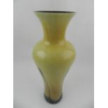 A brown and yellow glass vase. H.