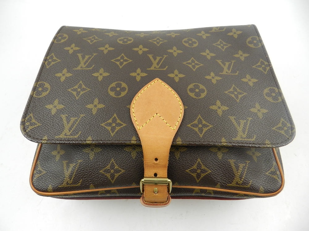 A Louis Vuitton cross-over monogrammed canvas messanger handbag.