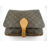 A Louis Vuitton cross-over monogrammed canvas messanger handbag.