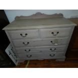 A limed oak chest of two short over three long drawers.