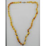 An amber beaded necklace.