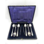 A set of early 20th century silver spoons and sugar nips.