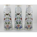 Three white opaline glass vases, possibly French, of conical form,