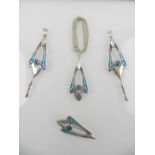 A silver, amethyst and blue and green enamelled pendant, earrings, and brooch,