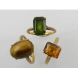 A yellow metal and oval cabouchon tigers eye ring,