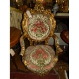 A pair of Louis XVI style carved giltwood fauteilles,