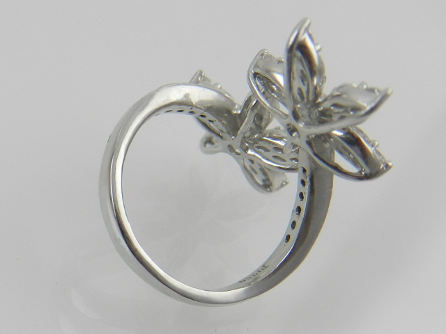 A platinum and diamond double flowerhead crossover design ring, - Image 2 of 2