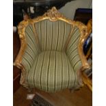 A single Louis XV style salon open armchair, having gilt frame and upholstered.